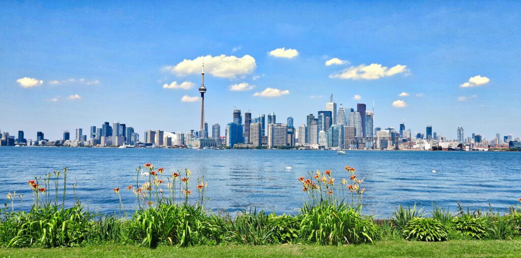 Toronto skyline with CN Tower across Lake Ontario — representing Canada skilled work visa and immigration opportunities for Asia and GCC applicants.